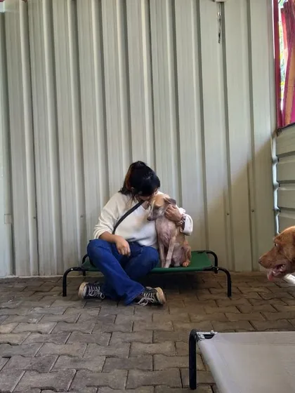 Another photo of me comforting a shy dog. My goal is to make every dog feel safe and understood.