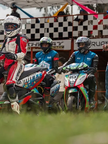 Amateur riders on their Ather electric scooters, lined up and ready for their track training session. We provide guidance to ensure everyone, even first-timers, can race safely.