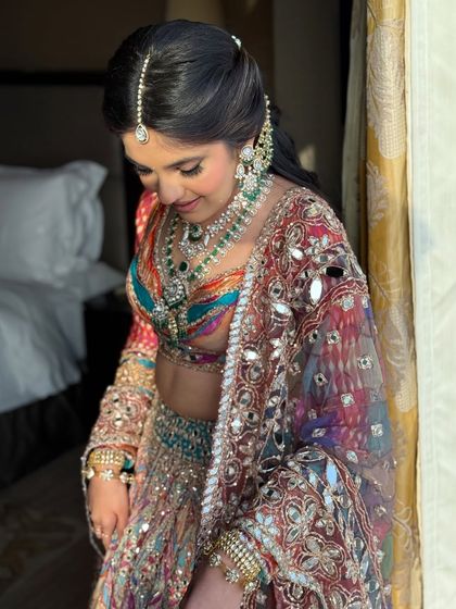 A close-up of the bride's colorful Garba night look, showing the intricate details of her jewelry and outfit.