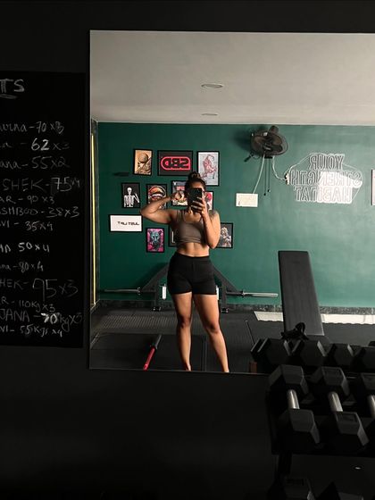 A mirror selfie celebrating the ups and downs of the growth process. Every day is a chance to get stronger.