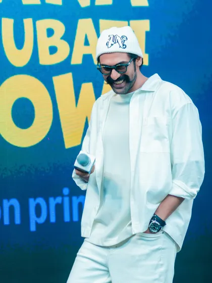 A candid moment from the Kingdom of White shoot with Rana Daggubati. The monochromatic styling looks effortlessly cool on stage, proving that all-white is a powerful choice for public appearances.