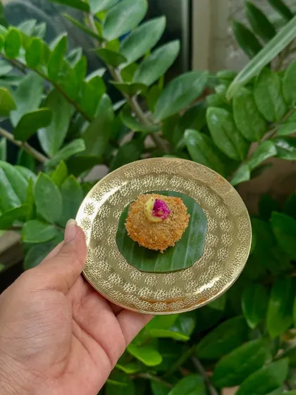 A Banana Flower Croquette, another unique offering from our Bengali menu, plated on a banana leaf for an authentic touch.