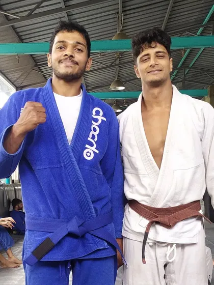 A proud moment in my journey: receiving my Blue Belt from my coach. BJJ is a long road and every step is earned, not given. I'm still learning and grinding every day, just like my students.