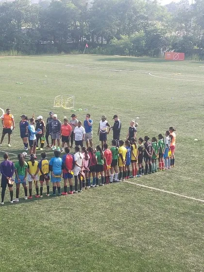 We have the privilege of working with large groups of dedicated athletes. This image shows a lineup of players at the FIFA development event, ready for their next drill.