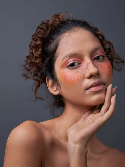 I love creating looks that feel like a painting. Here, I used a wash of warm blush and faux freckles to craft a unique, artistic beauty look with a soft, romantic feel.