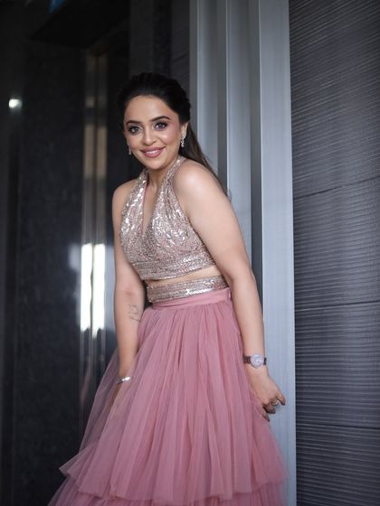 A happy and smiling portrait. She looks radiant and beautiful, ready for her special event.