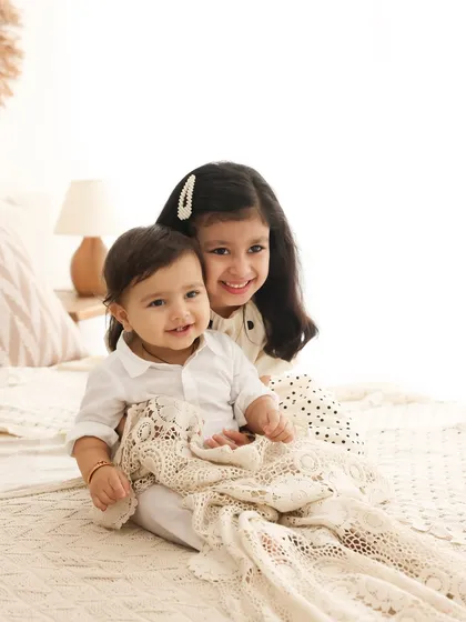 A sweet cuddle between siblings. The gentle embrace and happy smiles say it all. I aim to capture the natural affection between children in a simple, beautiful way.