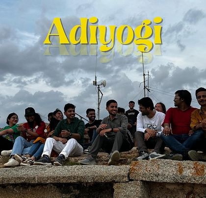 The Adiyogi trip crew relaxing on a historic fort wall, enjoying the view and the company.