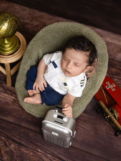A close-up of the little pilot, sleeping peacefully in his chair before his next big flight.