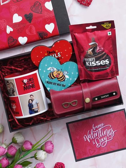 An overhead view of the Valentine Delight Hamper, showing all the personalized items neatly arranged. You can customize the mug with three pictures and the eyewear case with a name.