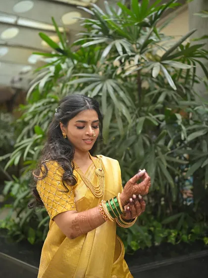 The bride-to-be playfully looking at her engagement ring.