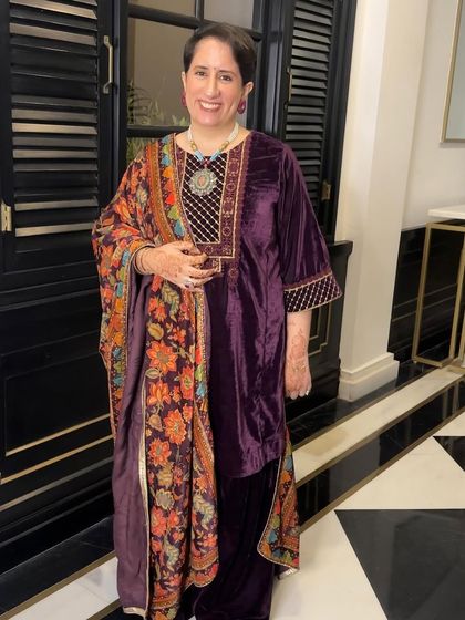 A rich and regal look in velvet for Guneet Monga. The makeup is warm and defined, perfectly complementing the luxurious texture of her outfit.