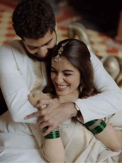A warm, happy embrace that shows pure joy. This candid-style shot from a pre-wedding session captures the couple's genuine affection and excitement for their upcoming wedding.