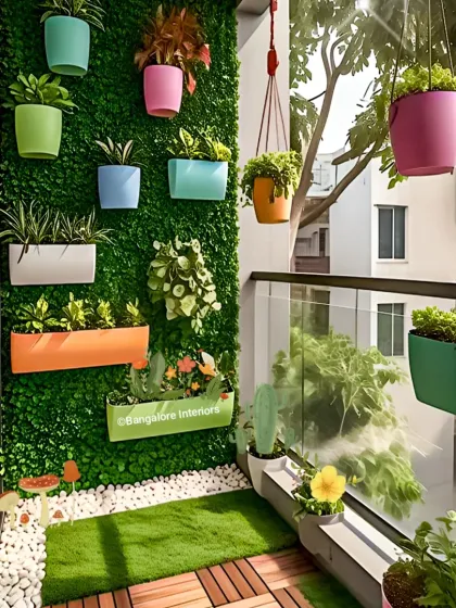 Another view of the colorful balcony, showing how hanging planters and a vertical garden can add life and privacy. The artificial grass and white pebbles create a clean and modern look.