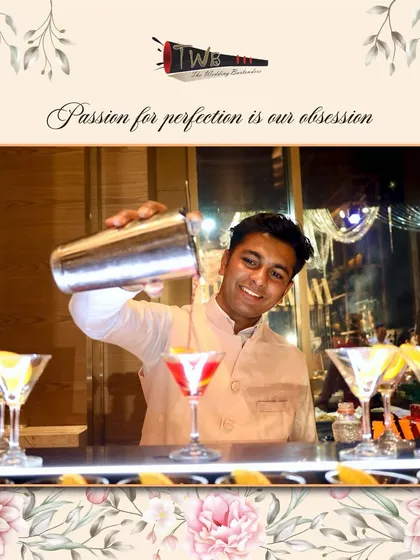 A bartender pours a beautiful pink mocktail into a martini glass, showing that our non-alcoholic drinks receive the same level of care and artistry.
