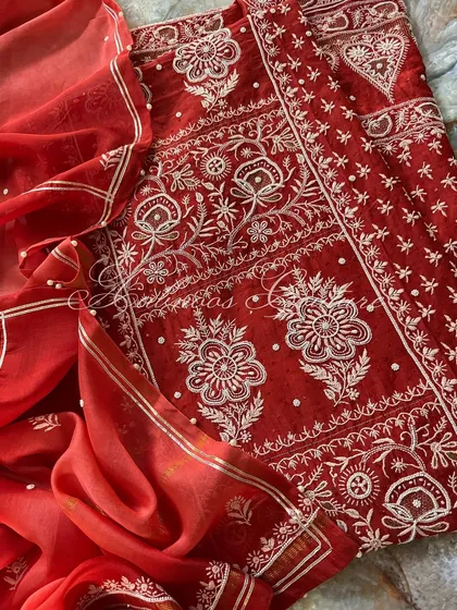 Another angle of the laid-out suit, highlighting the beautiful drape of the dupatta.