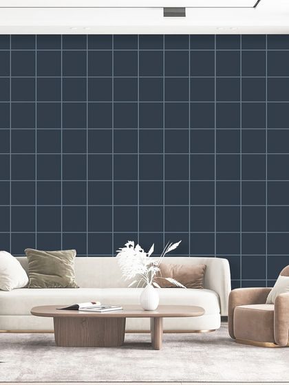 A simple and modern grid pattern in a deep navy blue. This minimalist design from the Polo collection provides a clean, structured backdrop that makes the contemporary furniture stand out.