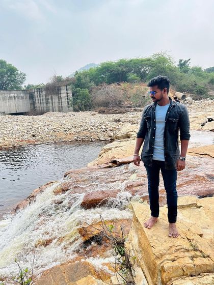 Enjoying the view of the flowing water and rocky terrain on a weekend trip.