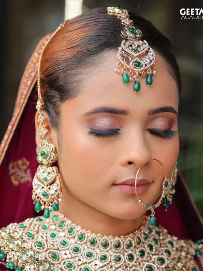 Student Work: A close-up of a soft glam bridal eye makeup look. The blend of pink and gold shimmer on the lids is a popular and versatile technique we teach.
