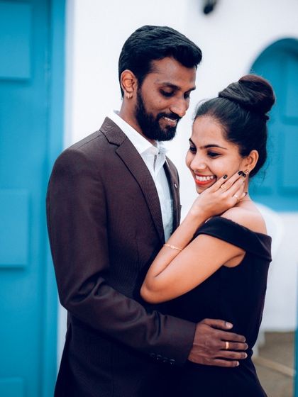 A happy couple sharing a smile. This kind of relaxed, joyful portrait is what we aim for in our pre-wedding shoots.