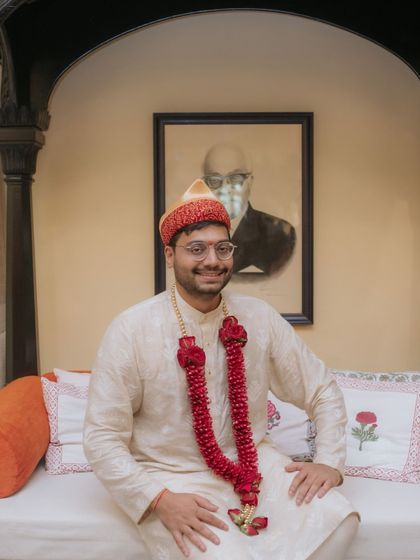 A portrait of the groom, looking happy and relaxed before his intimate wedding ceremony.