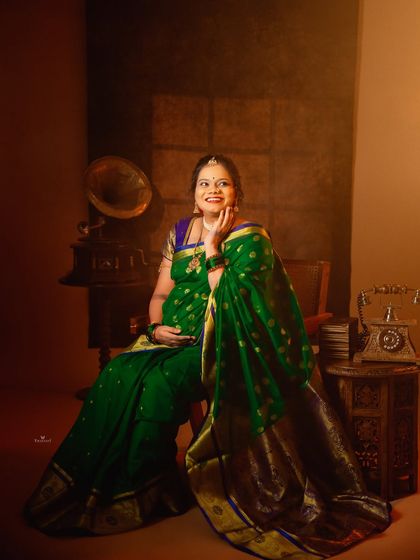 A happy and radiant portrait in a vintage setting. The mom-to-be's joyful expression is the centerpiece of this traditional maternity photo.