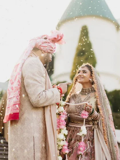 This moment from Vasav's wedding feels like a painting. Her pastel lehenga and our soft, luminous makeup came together to create a look that was absolutely dreamy and ethereal. It was all about capturing her gentle grace.