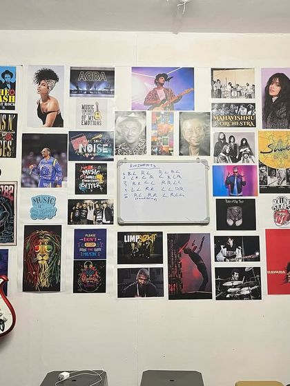 A shot of our studio's "wall of fame," covered in posters of legendary musicians that inspire us and our students every day.