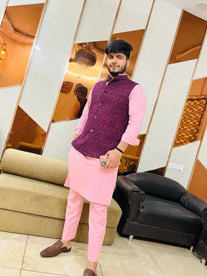 Another angle of the client in the pink and purple kurta-jacket set. This outfit is perfect for a guest who wants to look stylish and celebratory.