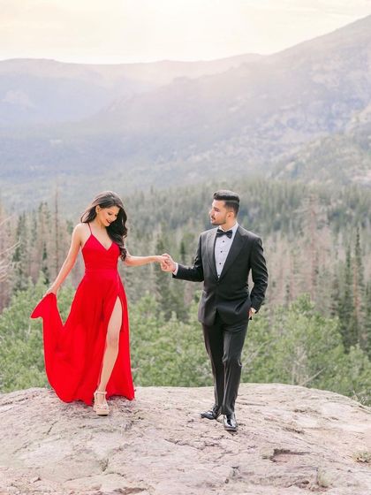 A romantic moment from a pre-wedding shoot in the mountains. The client is wearing my simple yet elegant red slit gown, which adds a beautiful pop of color to the natural scenery.