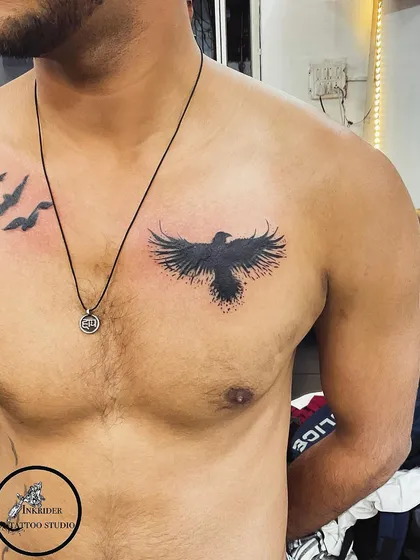 We covered up an unwanted name tattoo on the chest with this abstract black bird. The splatter effect helps to break up any underlying lines.