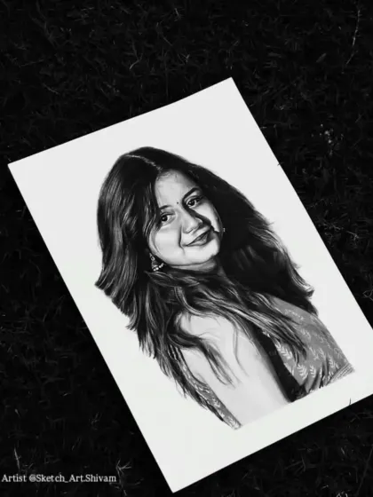 The finished portrait, placed on a dark, textured background to highlight the bright paper and detailed artwork.