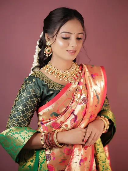 This shot shows the beautiful drape of the Paithani saree and the complementary makeup.