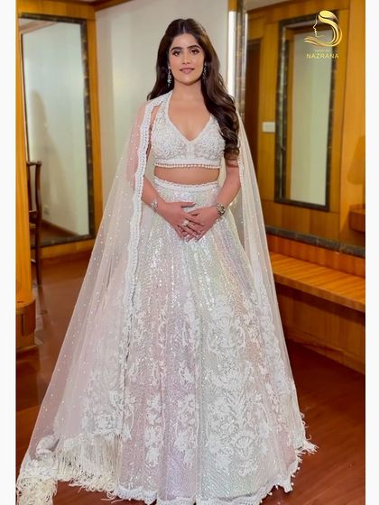 Another shot of the stunning bride, her voluminous curls adding to the glamour.