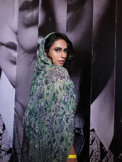 This look for the Anamika Khanna x H&M event features a dramatic smokey eye. The makeup was designed to be visible and impactful, even when partially veiled by the printed scarf.