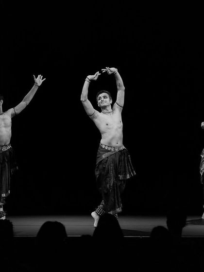 A black and white photo of the 'Abha' trio in motion. This captures the energy and flow of the choreography, highlighting the dancers' expressions and forms.