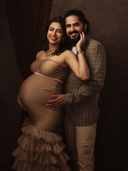 A beautiful couple's portrait where their joy and connection shine. The textures of her gown and his jacket complement each other perfectly.
