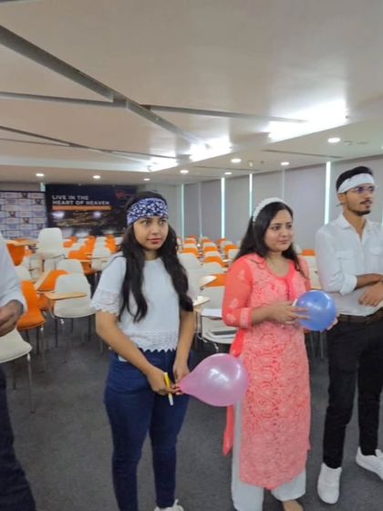 Another angle from our balloon game, showing how we get everyone involved. I ensure that even the quietest team members feel encouraged to participate, making it a truly inclusive team-building experience.