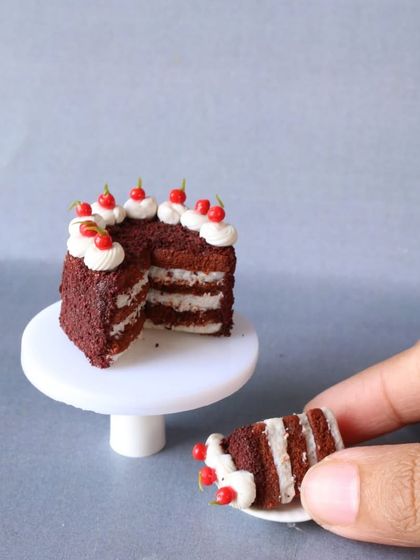 Another angle of my miniature red velvet cake, showing the creamy frosting.