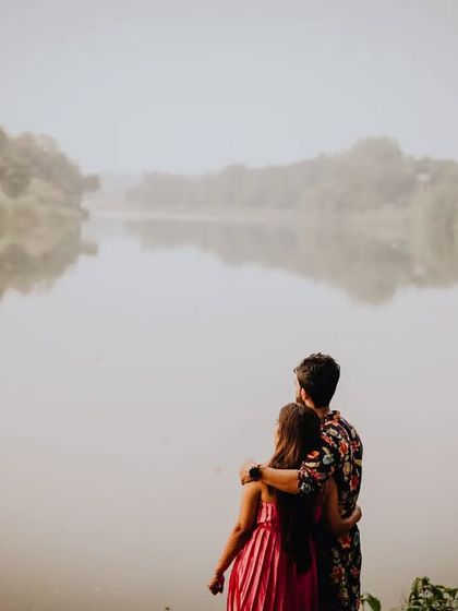 A quiet, misty morning by the lake. This pre-wedding shot captures a feeling of peace and togetherness, just the two of them against the world.