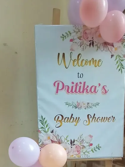A custom welcome sign for Pritika's Baby Shower, decorated with a few balloons to greet guests at the entrance.