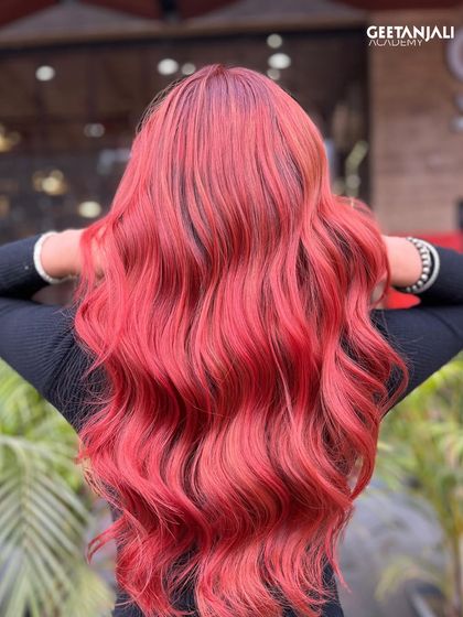For clients who want a bold statement, we teach how to create and maintain vibrant colours like this stunning, fiery red.