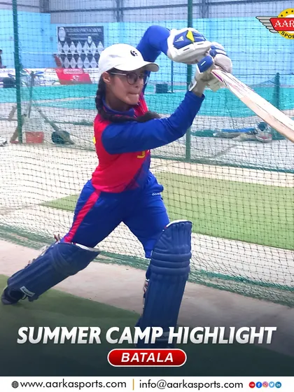 A female player in full batting gear during a net session at the summer camp. She is a great example of the dedication I see in my students.