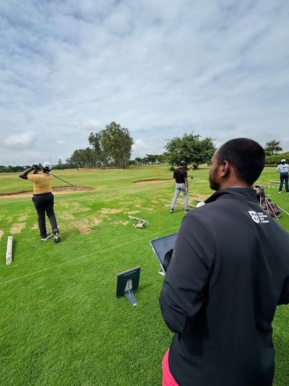 Using a tablet on the range, Coach Kiran provides real-time feedback. We equip our coaches with the tools and training to be effective and modern instructors.