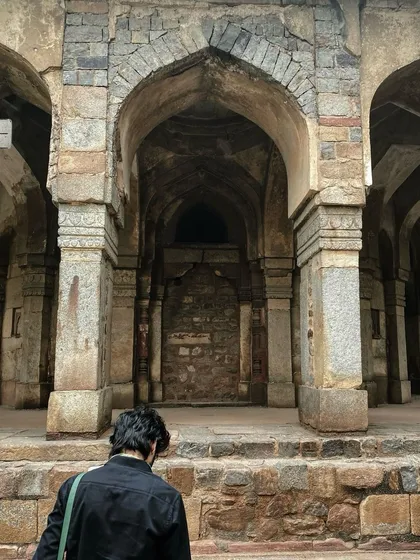 The stone arches of Lodhi Garden in Delhi, a quiet and contemplative space rich with history.