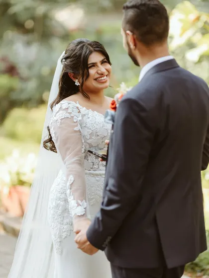 A heartfelt moment between the bride and groom during their vows.