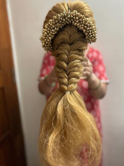 A full view of the practice fishtail braid, demonstrating the final look from start to finish. This is a core style taught in my bridal hairstyling module.