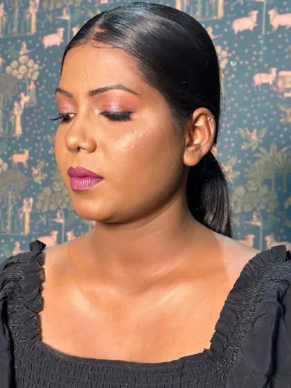A side profile of this stunning look on my dusky beauty. The glow on her cheekbones and the pop of color on her lips and eyes are perfectly balanced.