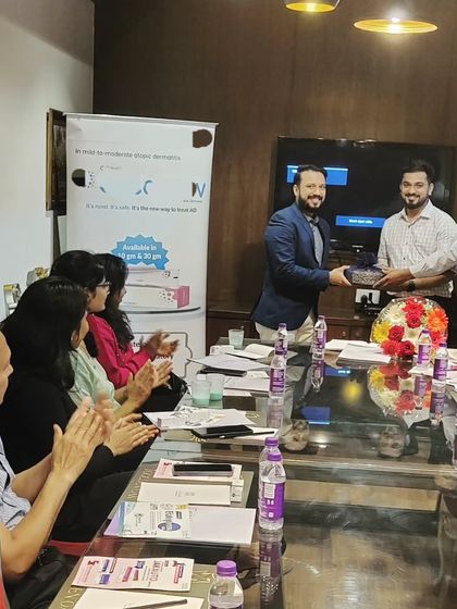 It is always a pleasure to engage with my peers. This photo was taken after a session where we discussed new treatments for Atopic Eczema. Collaborative learning helps elevate the standard of care for all our patients.