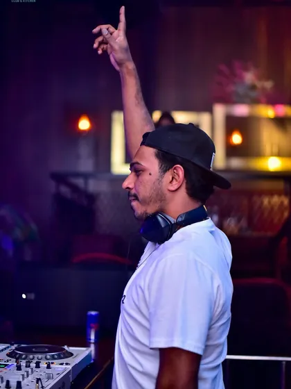 Reaching out to the crowd, asking them to meet me in the middle of the dance floor. It's all about creating a shared experience.
